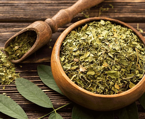 Senna herbs in wooden bowl